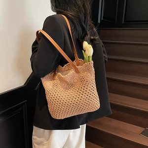 Handmade woven tote bag with floral hollow design and leather straps for summer beach