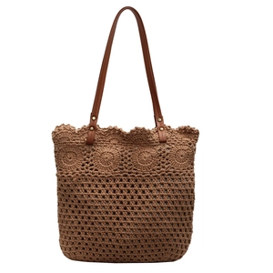 Brown handmade crochet hollow woven tote bag with leather straps for beach travel and summer