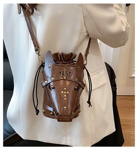 Detailed back view of a horse head bucket bag with metallic rivets and flower badge