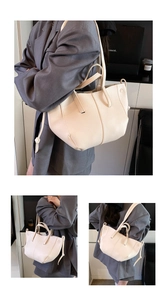 Detail shots of off-white lychee texture leather tote bag with unique folded design