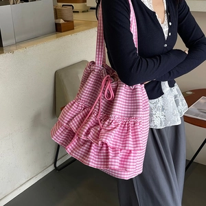 Pink checkered canvas tote bag with layered ruffle details and drawstring closure