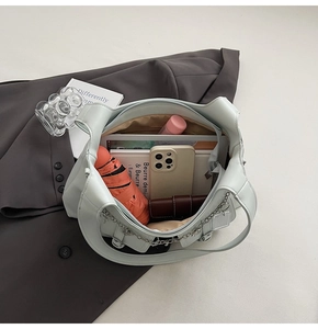 Top view of spacious mint green tote bag showing interior storage for daily essentials