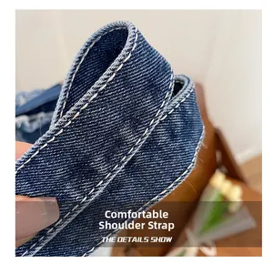 Macro shot of durable washed denim shoulder strap with white double stitching details
