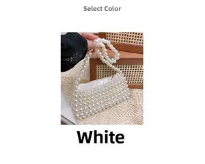 Detail of handcrafted white pearl beaded bag showing intricate woven texture and luster
