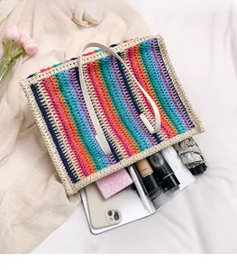Macro shot of rainbow striped woven tote bag showcasing spacious interior and high capacity
