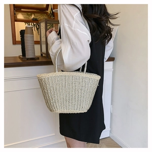 Detail showing the light beige woven texture with silver metallic thread on beach tote