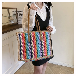 Detail of colorful striped crochet tote bag with premium brown leather shoulder straps