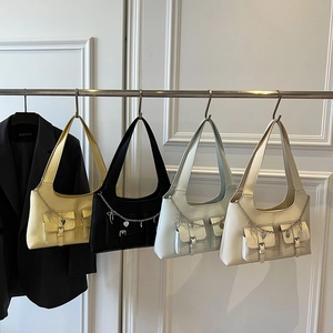 Hobo underarm bag in yellow, black, blue, and white with chic chain and heart charms