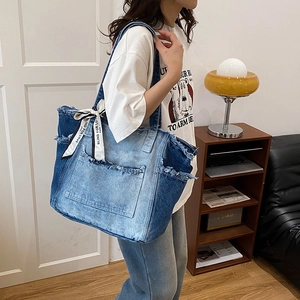 Large denim tote bag with distressed patchwork design and printed decorative scarf