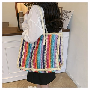 Close-up of colorful rainbow crochet tote bag with striped cotton weave pattern