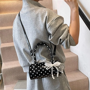 Black polka dot cylinder handbag with lace pearl bow charm and slim shoulder strap