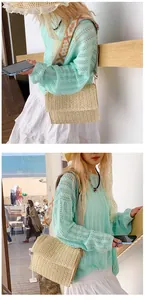 Straw crossbody bag featuring a bohemian geometric embroidered wide strap with woven texture