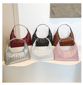 Collection of crescent Hobo bags featuring full silver rivet studs in six diverse colors
