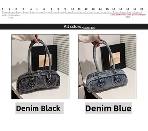 Detail view of denim boston bags in black and blue with vintage stitching and top handles