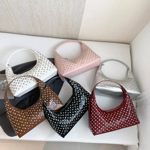Retro studded hobo shoulder bags in six vibrant colors with metallic rivet detailing