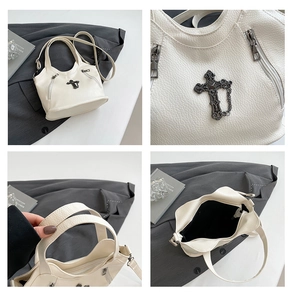 Detailed macro view of retro gothic cross ornament and litchi grain leather texture