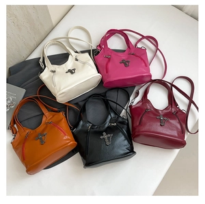 Collection of punk style crossbody bags featuring gothic cross details in five vibrant colors