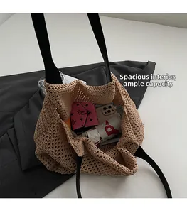 Top view of woven tote bag interior showing capacity for umbrella, phone, and books