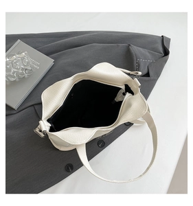 Top view of cream tote bag showing spacious interior with black zippered compartment