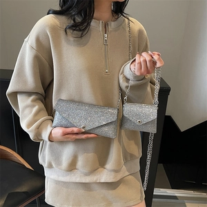 Sparkly silver sequin crossbody bag set with chain strap for women shown on model