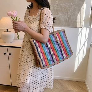 Rainbow striped straw tote bag with brown shoulder straps for summer beach vacation look