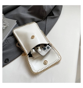 Detailed view of white PU phone bag with woven edges and gold chain interior space