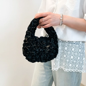 Elegant black ruffle mesh handbag with pleated layers and a single top handle