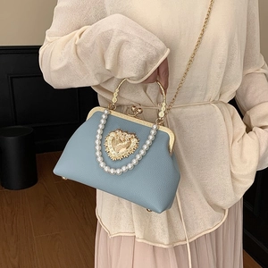 Baroque style light blue leather handbag with pearl handle and golden heart relief