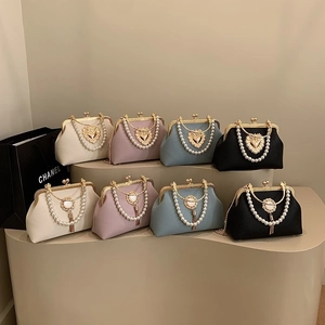Retro kiss lock shell bags with pearl handles and gold chains in assorted colors