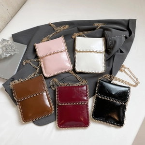 Sleek vertical chain phone bag in five colors with glossy PU leather and gold trim