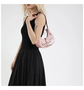 Pink Y2K crescent bag with silver rivets and metallic adjustable shoulder strap
