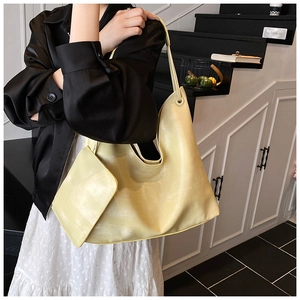 Light yellow oversized tote bag with matching zippered pouch pouch for daily commute