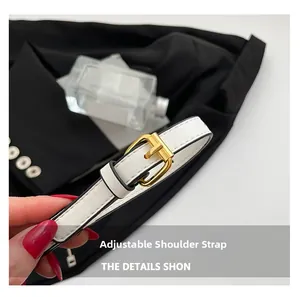 Detail of adjustable white leather strap with high-quality gold metal buckle