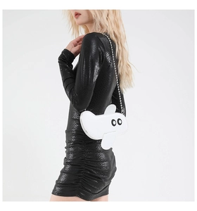 Creative white airplane shaped crossbody bag with metallic bead chain strap on model