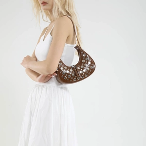 Brown crescent shoulder bag with silver studs and Y2K vintage style for women