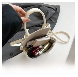Interior view showing the large capacity of the vintage cream white pillow bag