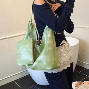Green leather tote bag set with matching pouch and vintage marbled texture for women