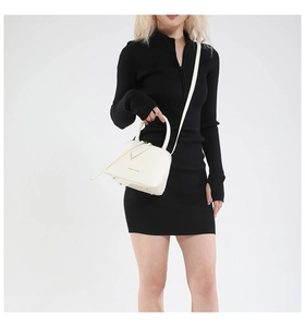 Detail view of cream leather Boston bag with gold studs and fashion letter engraving