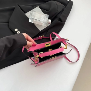 French style fuchsia crocodile texture handbag with gold hardware and dual compartments