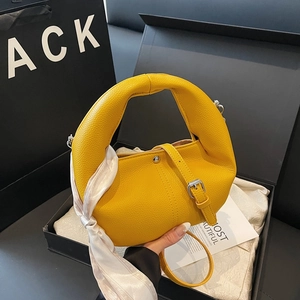 Chic yellow lychee leather handbag with silk scarf detail and silver hardware accents
