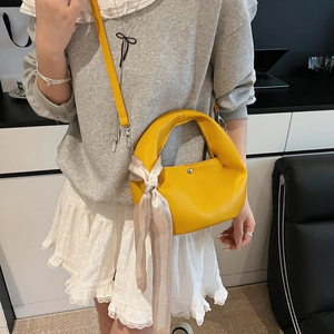 Bright yellow pebbled leather tote bag with silk scarf accent and crossbody strap
