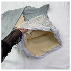 Detail view of the floral tote bag's inner lining and secure zipper pocket compartment