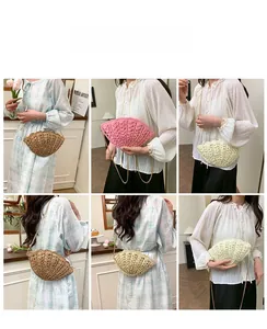 Detail of shell-shaped straw woven crossbody bag with elegant gold chain strap