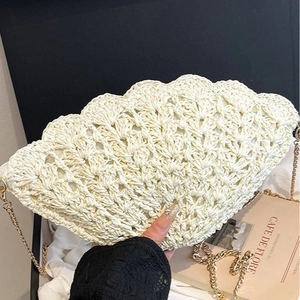 Shell shaped handwoven crochet crossbody bag with gold chain strap for summer beach style