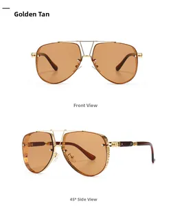 Detail of golden aviator sunglasses with hollow engraved temples and tan lenses