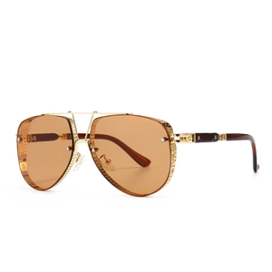 Modern retro aviator sunglasses with gold hollow metal frames and brown lenses
