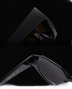 Close-up of durable metal hinges and model code K19053 on thick square sunglasses