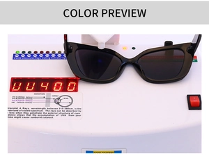Detail of black cat-eye sunglasses undergoing a professional UV400 protection test