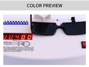 Black rectangle sunglasses showing UV400 protection test result on digital LED display