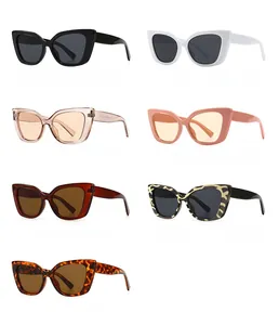 Flat lay of retro cat-eye sunglasses in multiple colors like black, leopard, and pink